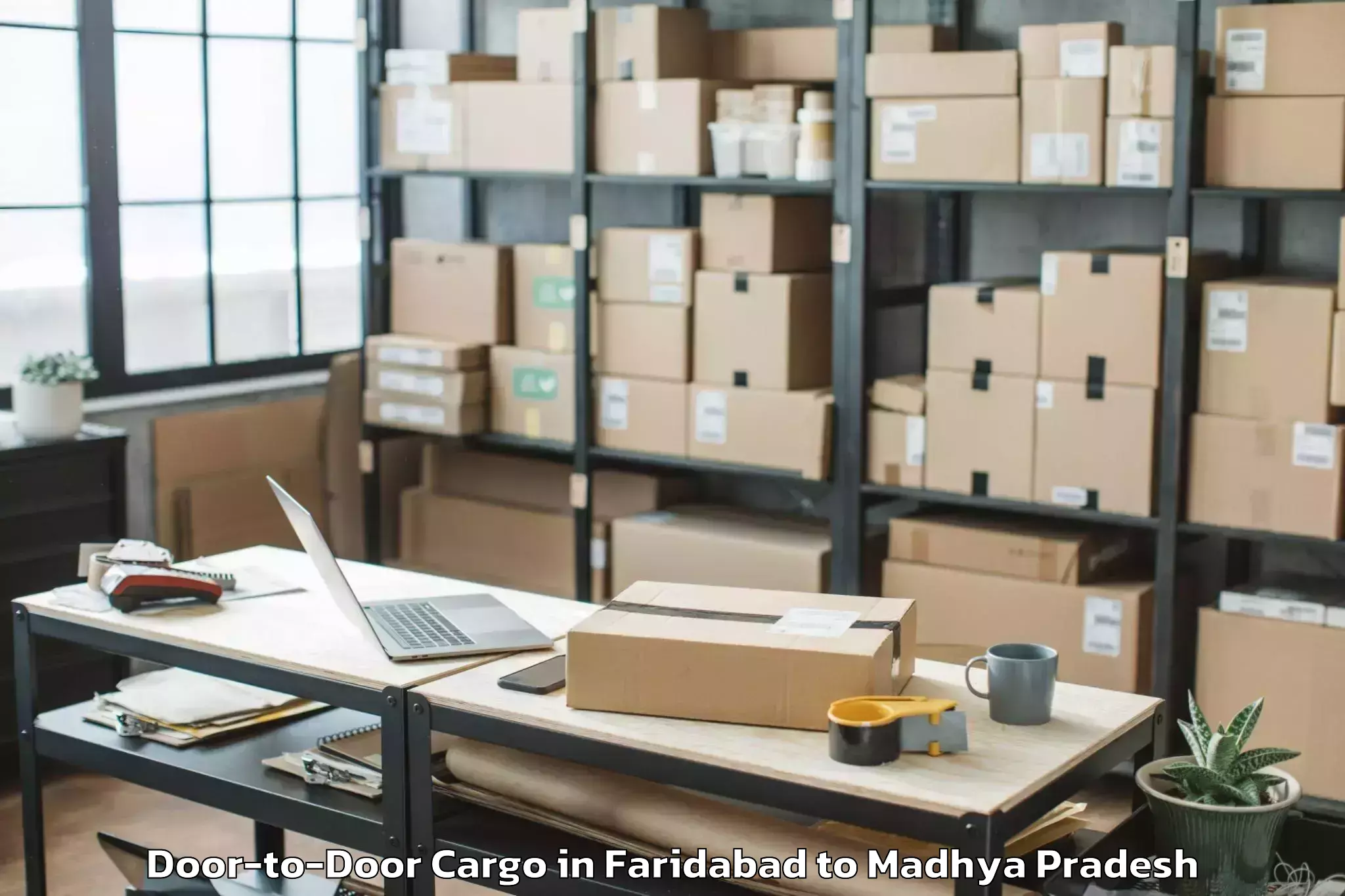 Faridabad to Alot Door To Door Cargo Booking